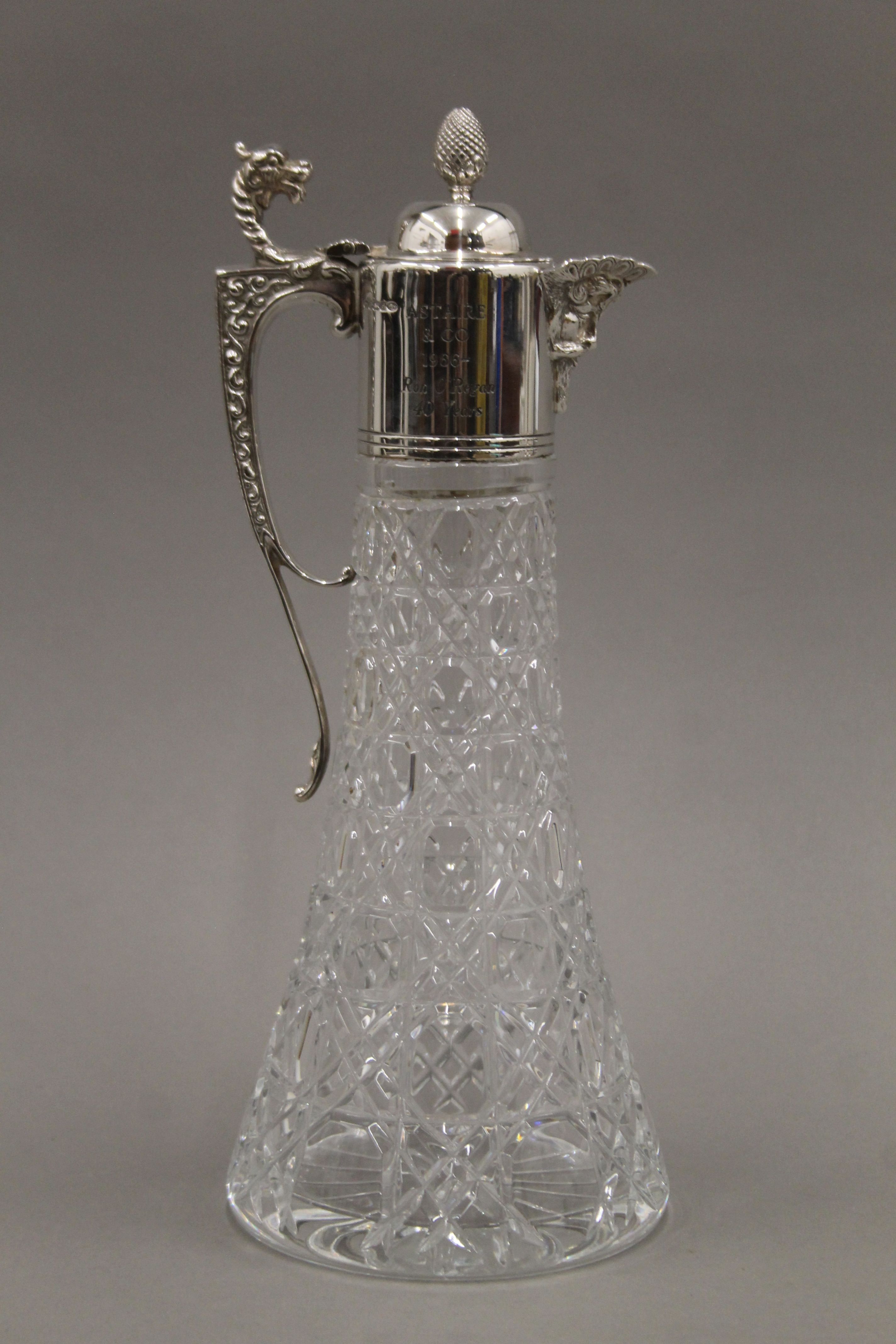 A pair of silver mounted cut glass claret jugs. 30.5 cm high. - Image 3 of 6