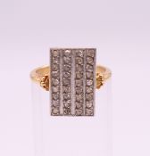 An unmarked gold and diamond ring. Ring size M.