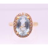 An 18 ct gold diamond and aquamarine ring. Ring size M/N.