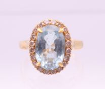 An 18 ct gold diamond and aquamarine ring. Ring size M/N.