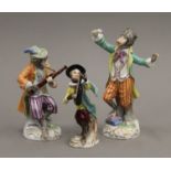 Three Continental monkey band figurines. The largest 16 cm high.