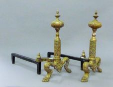 A pair of brass andirons. 41 cm high.