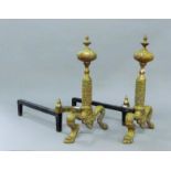 A pair of brass andirons. 41 cm high.