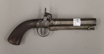 A 19th century percussion pistol. 27 cm long.