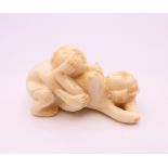 An erotic bone carving. 5 cm long.