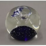 A glass comet paperweight. 6.5 cm high.