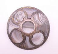 A banded agate and worked silver circular antique Scottish brooch, initials to reverse.