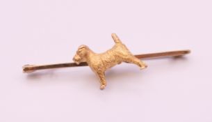 A 9 ct gold Terrier dog form brooch/tie pin. 5 cm long. 5.2 grammes.