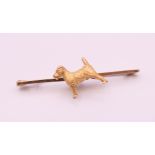 A 9 ct gold Terrier dog form brooch/tie pin. 5 cm long. 5.2 grammes.