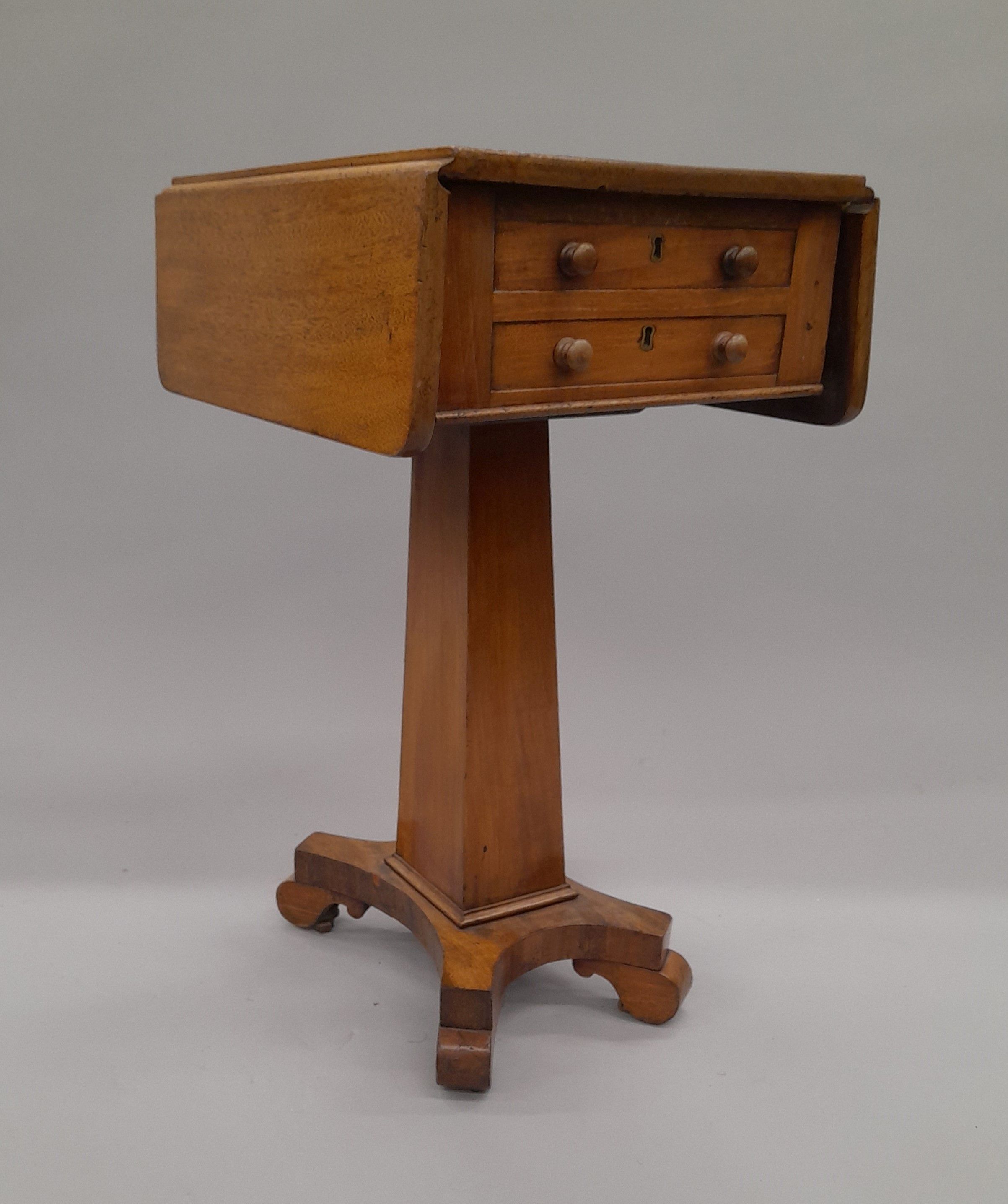 An early 19th century mahogany pedestal Pembroke work table. 33.5 cm wide flaps down.