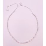 An 18 ct white gold and diamond adjustable necklace. 40 cm long. 9.2 grammes total weight.