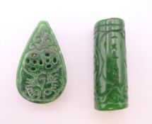 Two jade beads. Each 4 cm high.