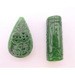 Two jade beads. Each 4 cm high.