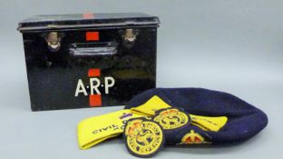 An A.R.P tin containing a cap and arm bands.