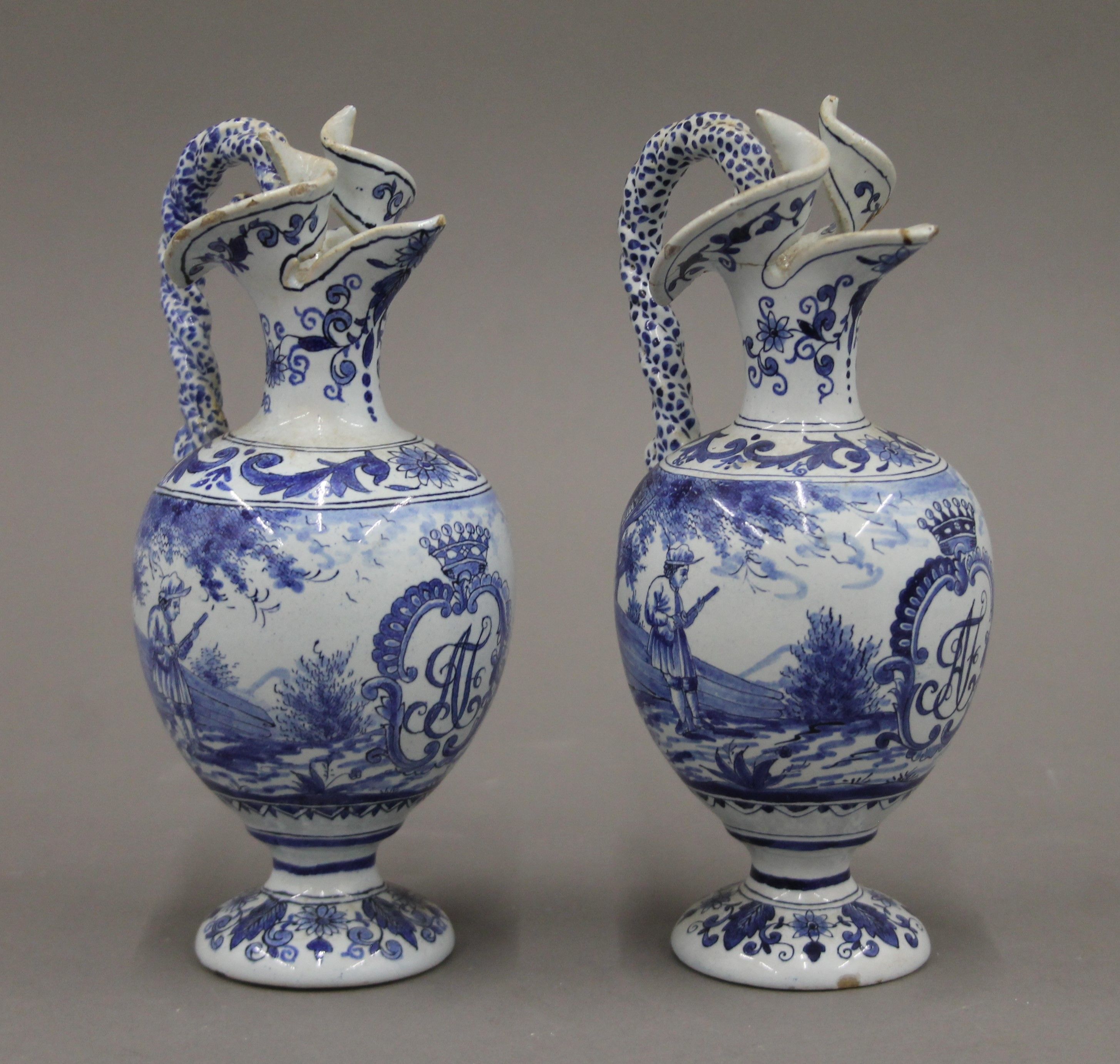 A pair of small 19th century blue and white ewers. 17.5 cm high.