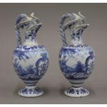 A pair of small 19th century blue and white ewers. 17.5 cm high.