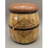 A leather top Hendricks barrel stool. 54 cm high.