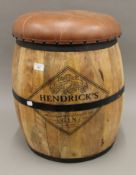 A leather top Hendricks barrel stool. 54 cm high.