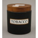 A vintage Dunhill tobacco box. 11 cm high.