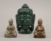 Three hardstone models of Buddha. The largest 10 cm high.
