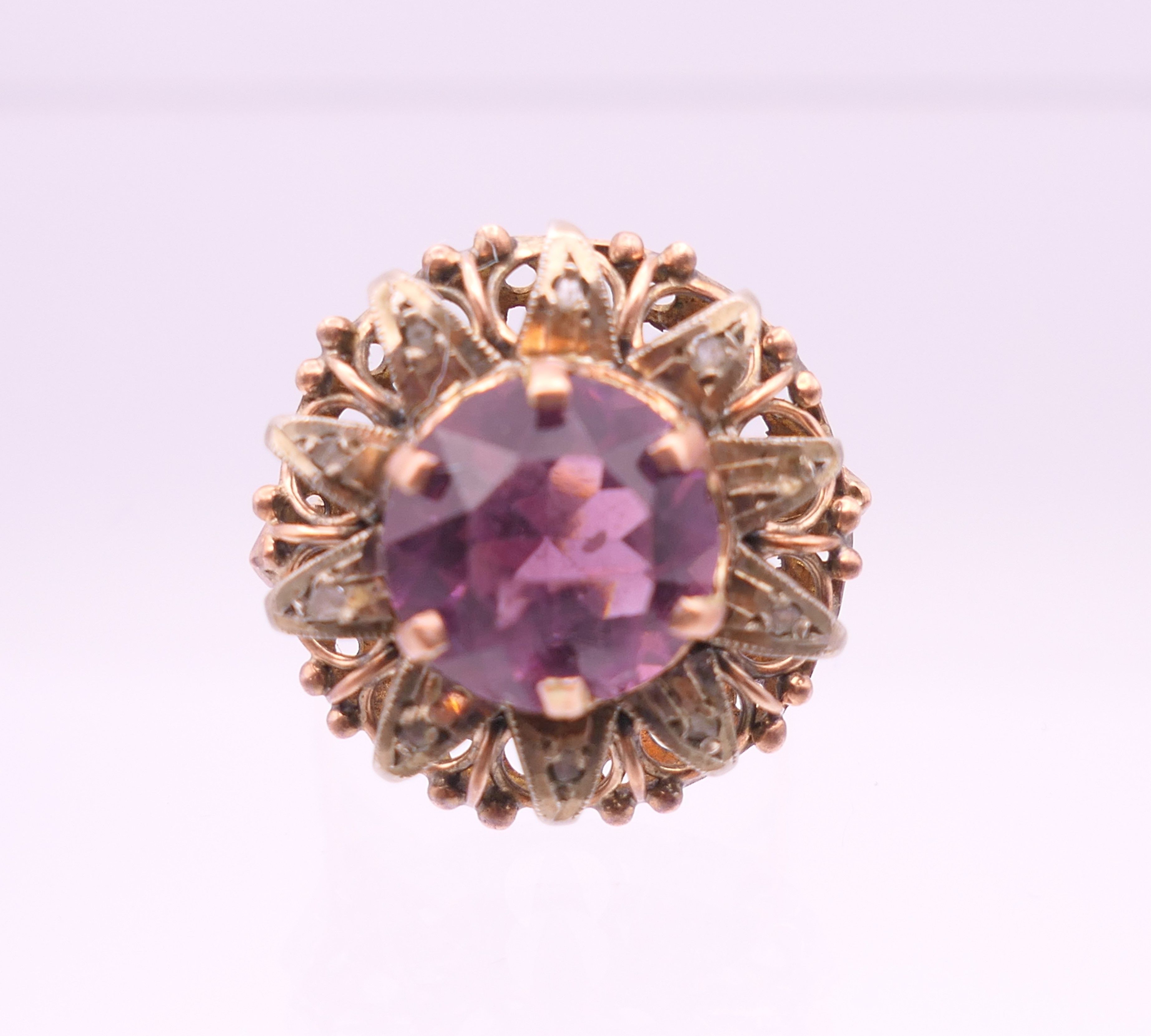 A 9 ct gold, amethyst and diamond flowerhead ring. Ring size Q. - Image 2 of 6