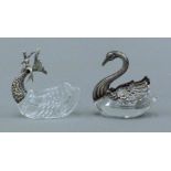 A Continental silver mounted swan form salt and a Continental silver mounted mermaid form salt.
