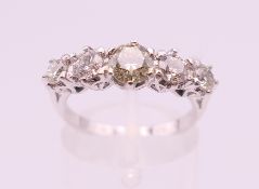 An 18 ct white gold five stone diamond ring. Total diamond weight approximately 1.2 carats.