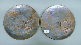 A pair of Japanese cast metal chargers. 29.5 cm diameter.