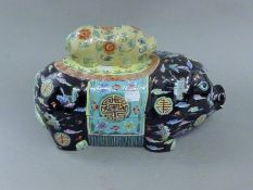 A Chinese porcelain pig tureen. 38 cm long.