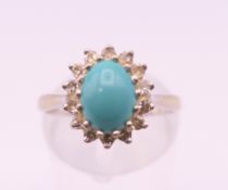 An 18 ct white gold diamond and turquoise ring. Ring size M/N.