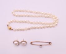 A pearl necklace with 9 ct gold clasp,