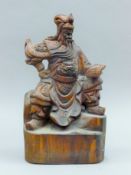 A Chinese carving of a warrior. 33 cm high.
