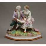 A 19th century Continental porcelain figural group. 20 cm high.