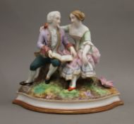 A 19th century Continental porcelain figural group. 20 cm high.