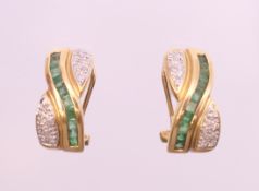 A pair of diamond and emerald earrings. 1.5 cm high.