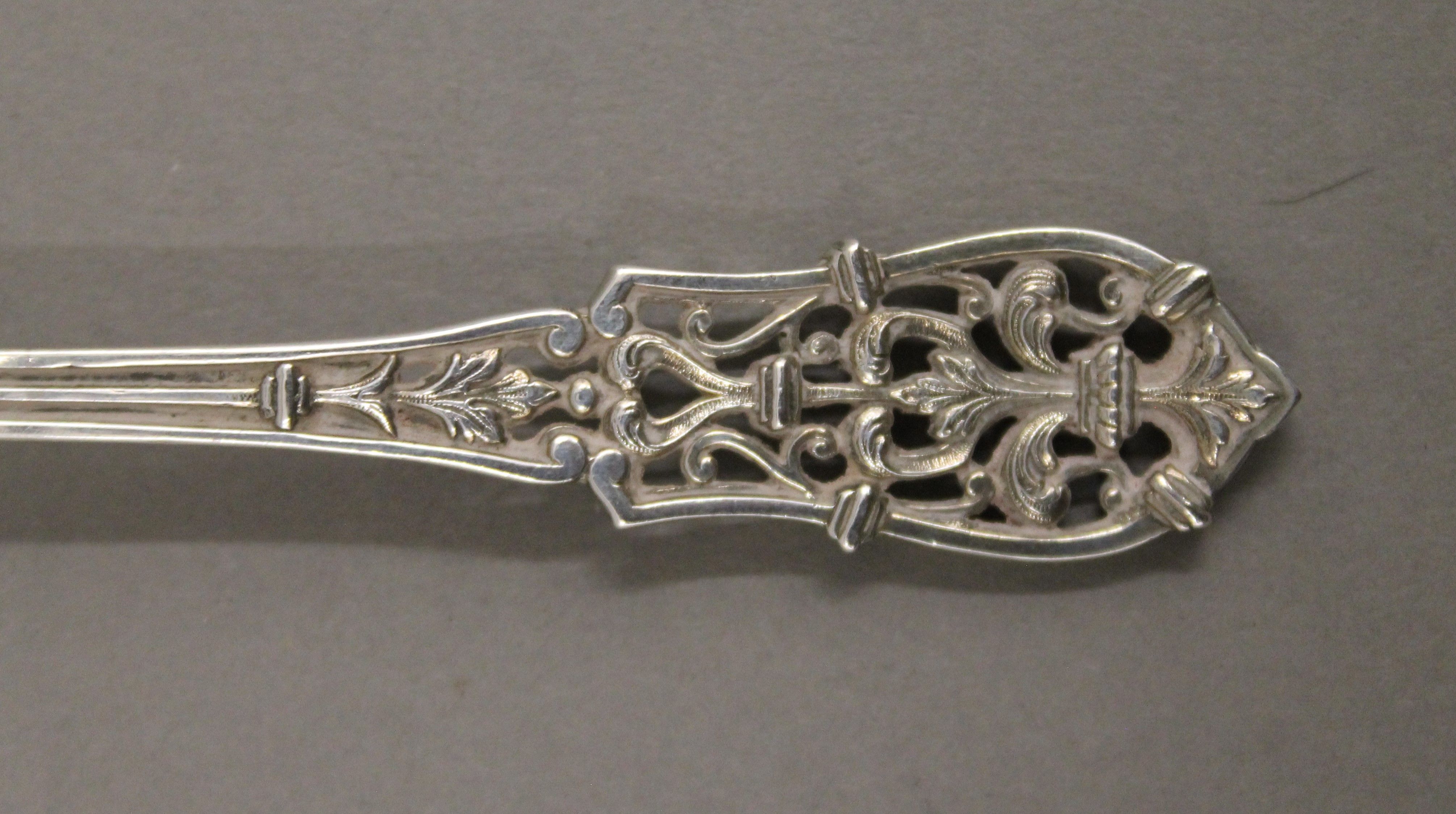 A set of four Continental pierced silver patisserie servers and eaters. The largest 17 cm long. 100. - Image 4 of 4