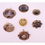 A quantity of Victorian brooches including banded agate. Largest 5.5 cm wide.