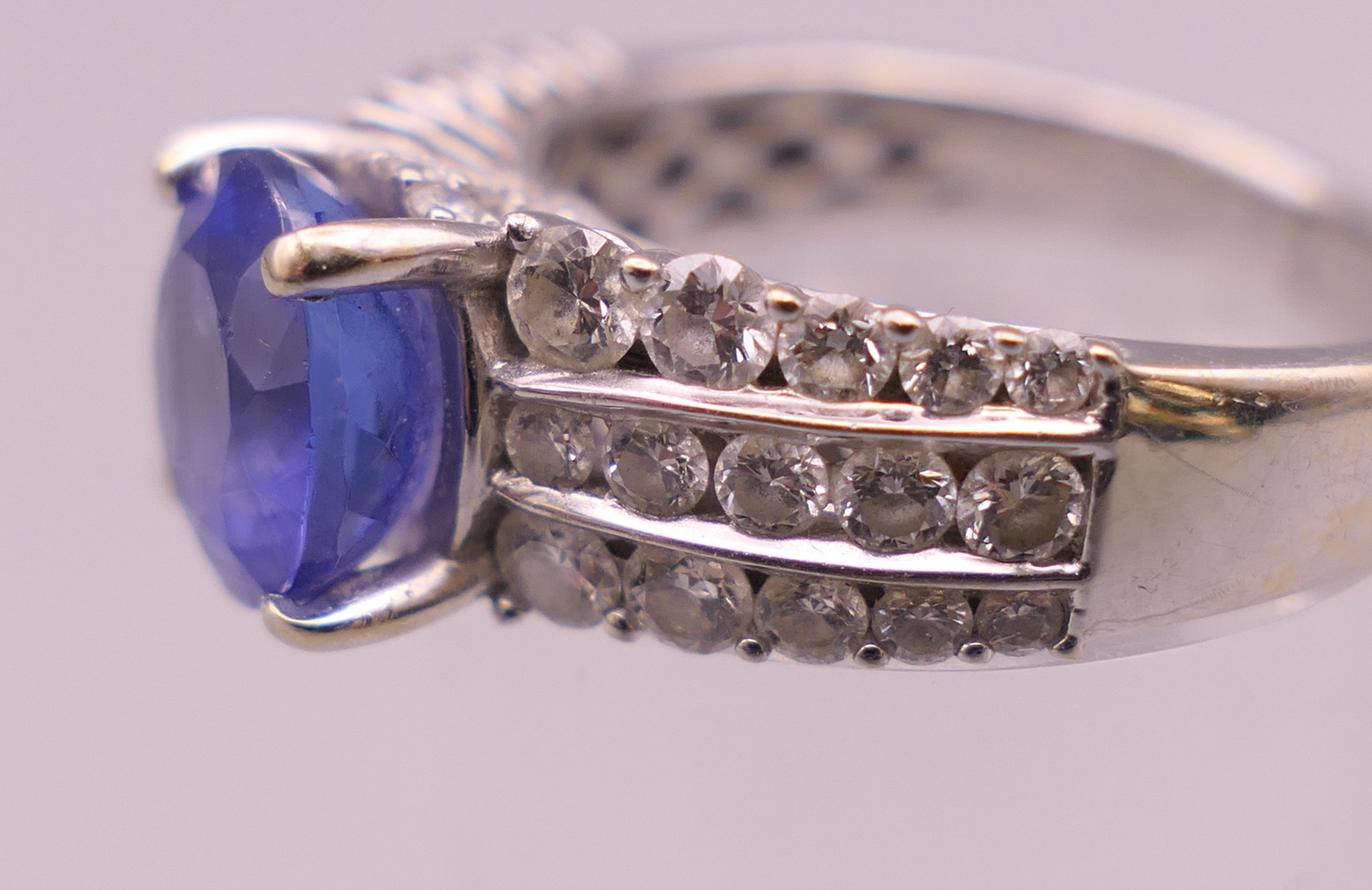 An 18 K white gold diamond and tanzanite ring; - Image 5 of 6