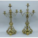 A pair of Victorian brass candelabra. 58 cm high.