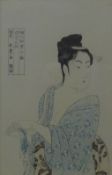 A Japanese print of a woman, framed and glazed. 23.5 x 38 cm.