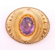 A Victorian unmarked gold, probably 18 ct gold, amethyst mourning brooch, boxed. 4.5 cm x 3.5 cm.