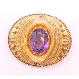 A Victorian unmarked gold, probably 18 ct gold, amethyst mourning brooch, boxed. 4.5 cm x 3.5 cm.