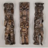 Three antique oak figural carvings. Each approximately 38 cm high.