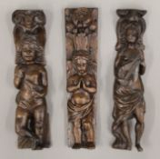 Three antique oak figural carvings. Each approximately 38 cm high.