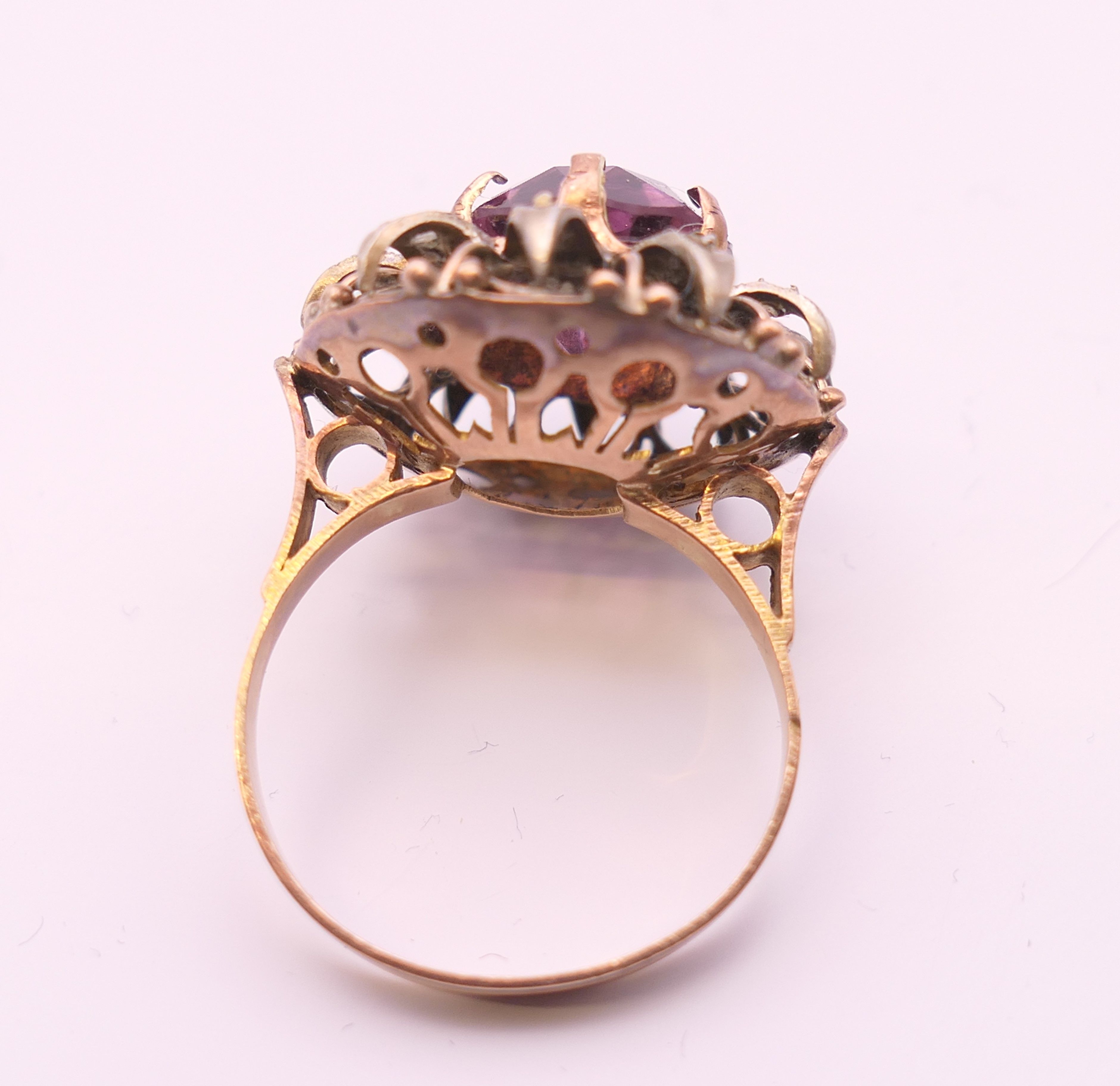 A 9 ct gold, amethyst and diamond flowerhead ring. Ring size Q. - Image 5 of 6