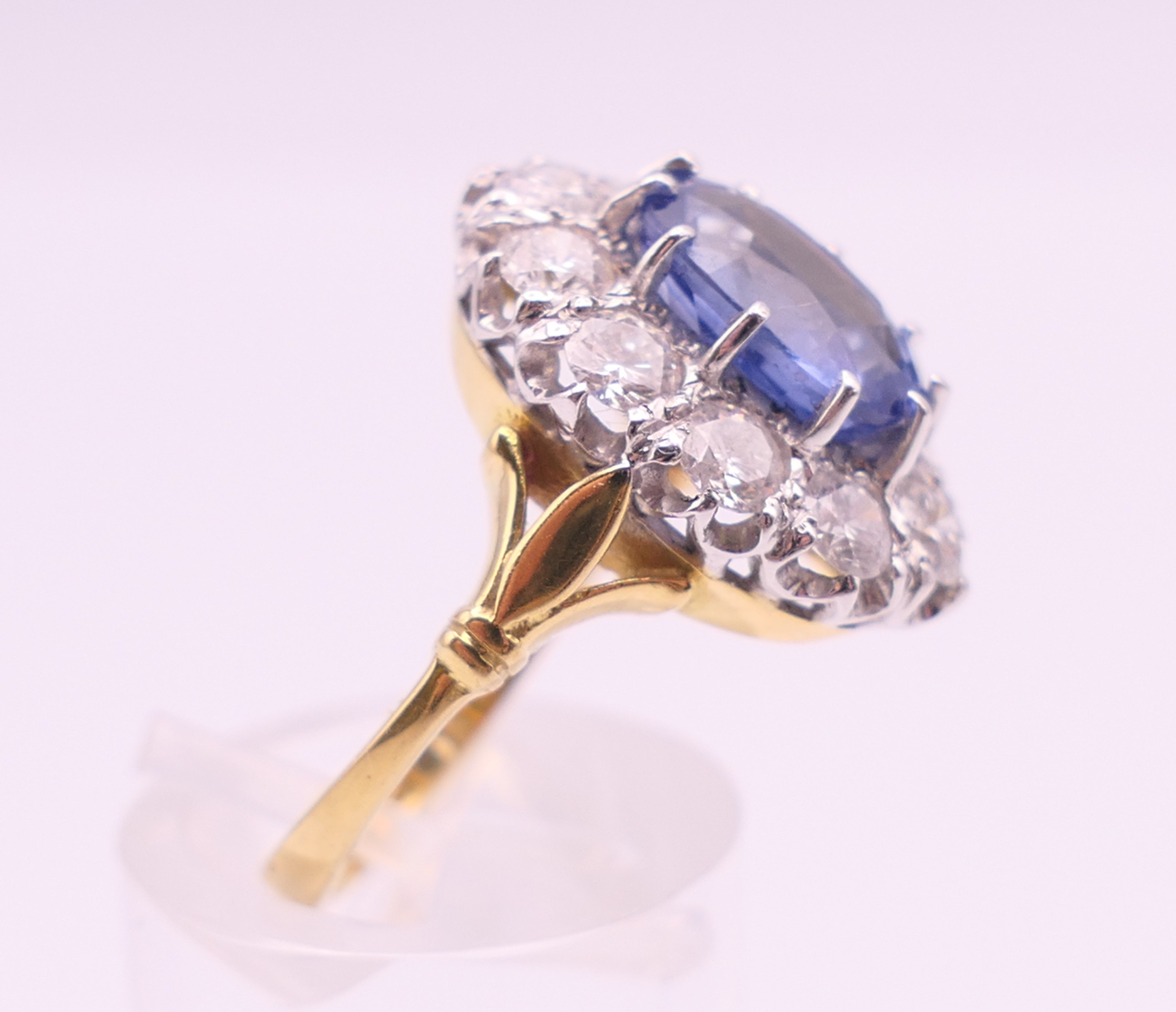 An 18 ct gold and platinum diamond and sapphire ring. - Image 5 of 9