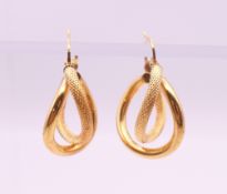 A pair of 9 ct gold earrings. 2.5 cm high. 1.7 grammes.