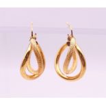 A pair of 9 ct gold earrings. 2.5 cm high. 1.7 grammes.