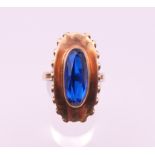 A 8 K gold blue stone ring. Ring size T. 6.8 grammes total weight.