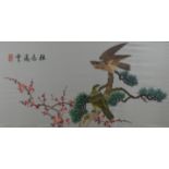 A Chinese embroidered silk picture depicting birds of prey, framed and glazed. 90 x 45 cm.
